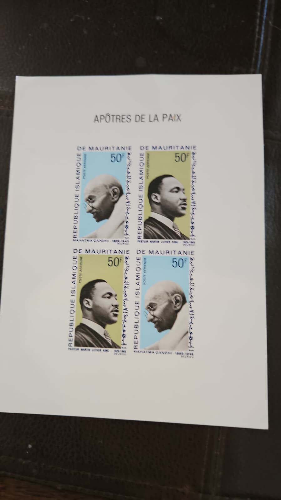 An unperforated printer's proof sheet of four Mauritania airmail postage stamps titled 'Apotres de la Paix' featuring Mahatma Gandhi and Dr. Martin Luther King Jr.